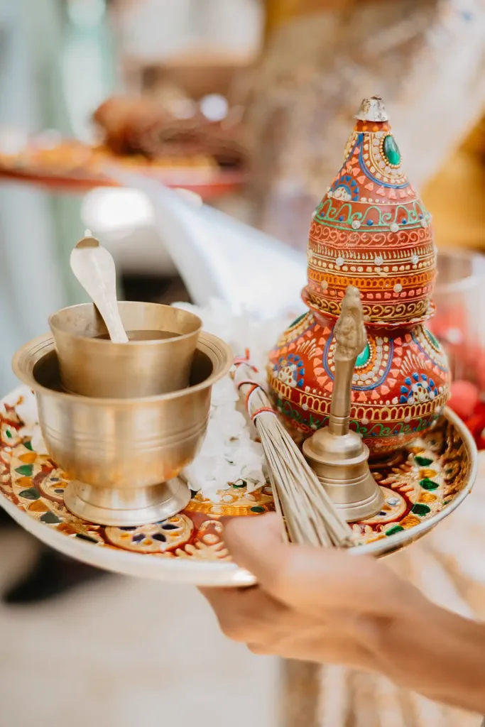 A brass puja thali carried in for the ceremony